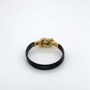 18kt gouden ring+olifantenhaar, maat 51/16,25, 0,46 gr kopen? Bied vanaf 50!