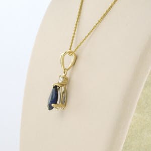 14k gouden collier met hanger bezet met saffier en briljant geslepen diamant kopen? Bied vanaf 200!