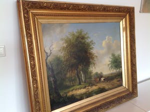 Hendrikus van de Sande Bakhuyzen - A wooded landscape with a horseman conversing with a herdsman and cattle kopen? Bied vanaf 2000!