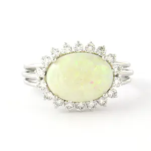 18k gouden ring met centraal opaal en briljant geslepen diamant tot. 0.36ct kopen? Bied vanaf 640!