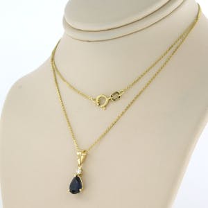 14k gouden collier met hanger bezet met saffier en briljant geslepen diamant kopen? Bied vanaf 200!