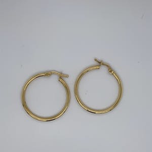 14kt gouden oorringen - 1,81gr kopen? Bied vanaf 65!