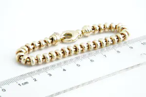 44- Aparte,  14 karaats gouden kinder/dames "ringetjes" model armband kopen? Bied vanaf 430!