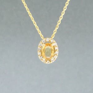 14kgouden collier met hanger bezet met gele saffier en briljant geslepen diamant kopen? Bied vanaf 1!