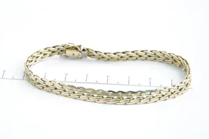 NV(54) - Mooie 14 karaats geel-gouden dames armband met dubbele scroll schakel kopen? Bied vanaf 680!