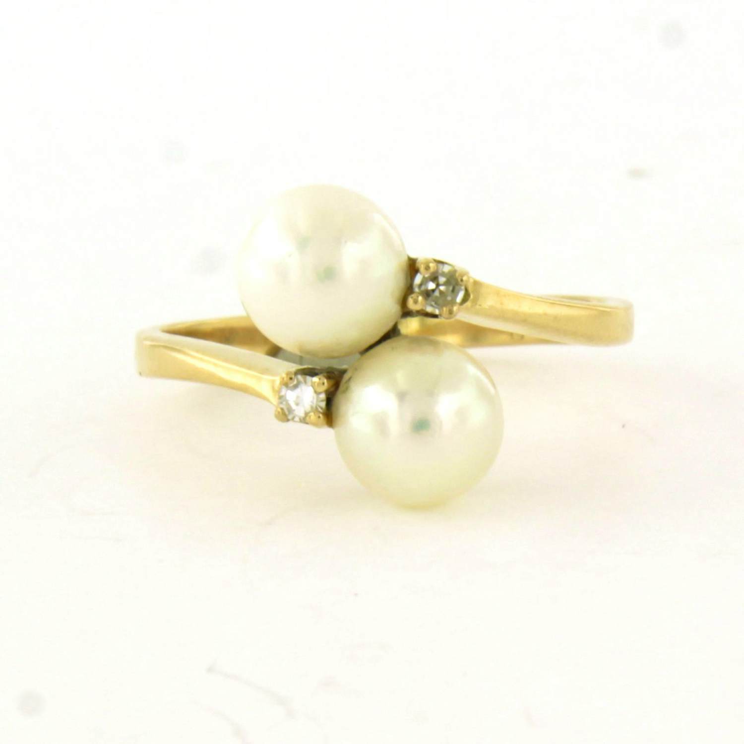 18k geel gouden ring bezet met parel en single cut geslepen diamant tot. 0.03ct verkocht voor € 260!