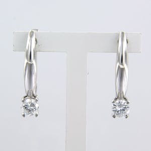 14k wit gouden oorhangers bezet met briljant geslepen diamant tot. 0.56ct kopen? Bied vanaf 750!