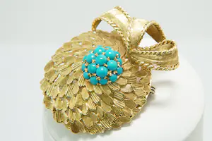 52- Vintage fifties 18Krt gouden fantasie broche met strik en turqoise steentjes kopen? Bied vanaf 940!