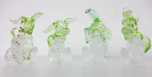 Yvon Trossèl - Zes transparant-groene glazen kaarsenstandaarden met bladmotief kopen? Bied vanaf 125!