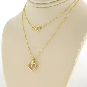 14k gouden collier met hanger bezet met briljant geslepen diamant kopen? Bied vanaf 110!