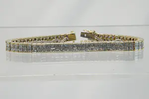 Acheter19 - 18 karaats geelgouden armband met ca 13 crt princess geslepen diamanten? Enchérissez de 4850!