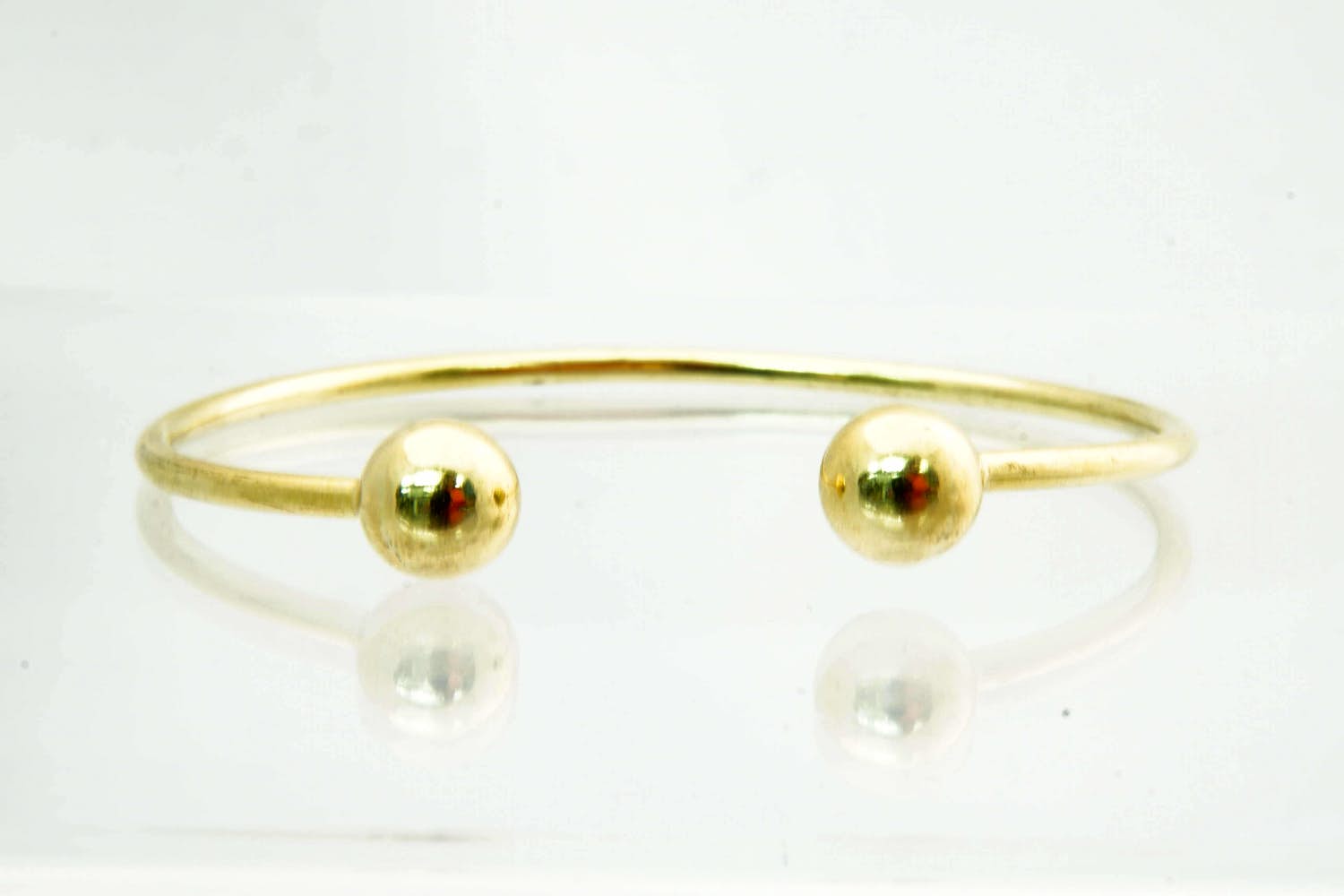 10 - Elegante 18 karaats geel-gouden "bolletjes" armband gekeurd kopen? Bied vanaf 620!