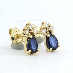 14k geelgouden oorknoppen bezet met saffier 1,20ct en briljant geslepen diamant kopen? Bied vanaf 260!