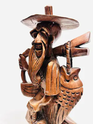 AcheterOnbekend - Handgesneden houten visser met vis? Enchérissez de 20!