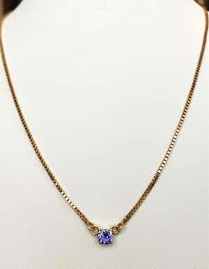 14 karaat geel goud collier met  0.60 ct Tanzaniet hanger verkocht voor € 220!