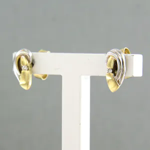 14k bicolour gouden oorknoppen bezet met briljant geslepen diamant tot 0,02ct kopen? Bied vanaf 1!