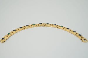 1221- Fraaie 18 karaats gouden "3 om 1" armband - saffier en smaragd - cabuchon kopen? Bied vanaf 920!