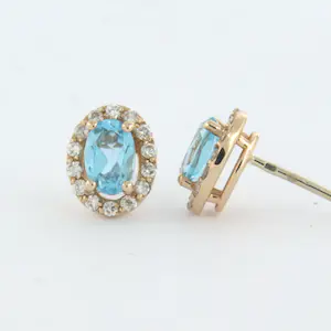 14k rosé gouden entourage oorknoppen met topaas en briljant geslepen diamant kopen? Bied vanaf 375!