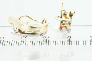 Prachtige set 18 krt bi-color gouden dames oorclips gezet met ca 0.30ct diamant. kopen? Bied vanaf 350!
