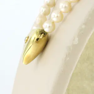 18k gouden hartvormslot bezet met single cut geslepen diamant aan parel collier kopen? Bied vanaf 185!