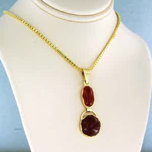 14k geelgouden collier met een gouden hanger bezet met carneool - 50 cm lang verkocht voor € 260!