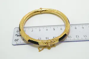 6 - grote Surinaamse 14Krt geel gouden armband met zwarte kunststof kern kopen? Bied vanaf 450!