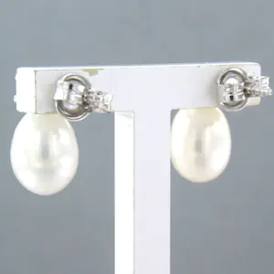 18k wit gouden oorknoppen met parel en briljant geslepen diamant kopen? Bied vanaf 280!