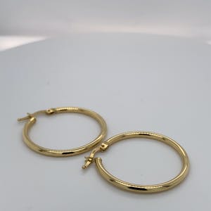 14kt gouden oorringen - 1,81gr kopen? Bied vanaf 65!