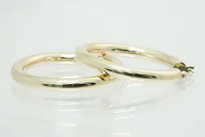 69- Groot en zo goed als nieuw paar 14krt geel-gouden oorringen - Creolen kopen? Bied vanaf 190!