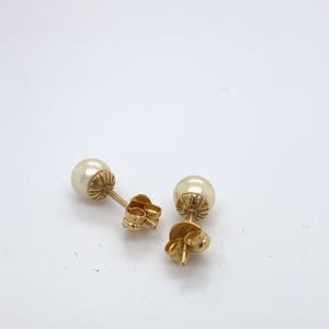 18kt gouden oorsteker+parel, 1,31 gr kopen? Bied vanaf 80!