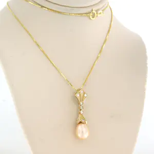 14k gouden collier en hanger met parel en single cut geslepen diamant tot.0.20ct kopen? Bied vanaf 280!