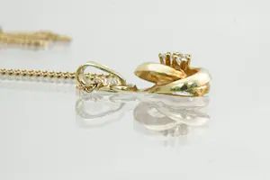 125 - Zeer fijn 14 Krt gouden gourmette collier met opengewerkte knoop hanger kopen? Bied vanaf 85!