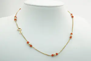 1865 - Sierlijk 18 Krt geel-gouden gourmette collier - met bloedkoraal kopen? Bied vanaf 250!