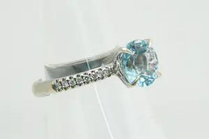 54 - Chique 18Kt witgouden & diamanten ring 0.15ct briljant en grote Aquamarijn kopen? Bied vanaf 280!