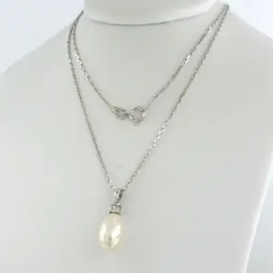 14k gouden collier met hanger met parel en diamant 0.10 ct kopen? Bied vanaf 280!