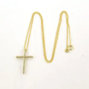 14k geelgouden collier met kruishanger bezet met diamant 0.27 ct kopen? Bied vanaf 440!