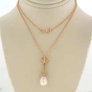 14k gouden collier en hanger met parel en single cut geslepen diamant 0.20ct kopen? Bied vanaf 440!