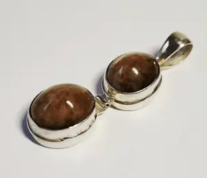 Nieuwe handgemaakte  langwerpige zilveren hanger met een mooie tijgerogen kopen? Bied vanaf 60!