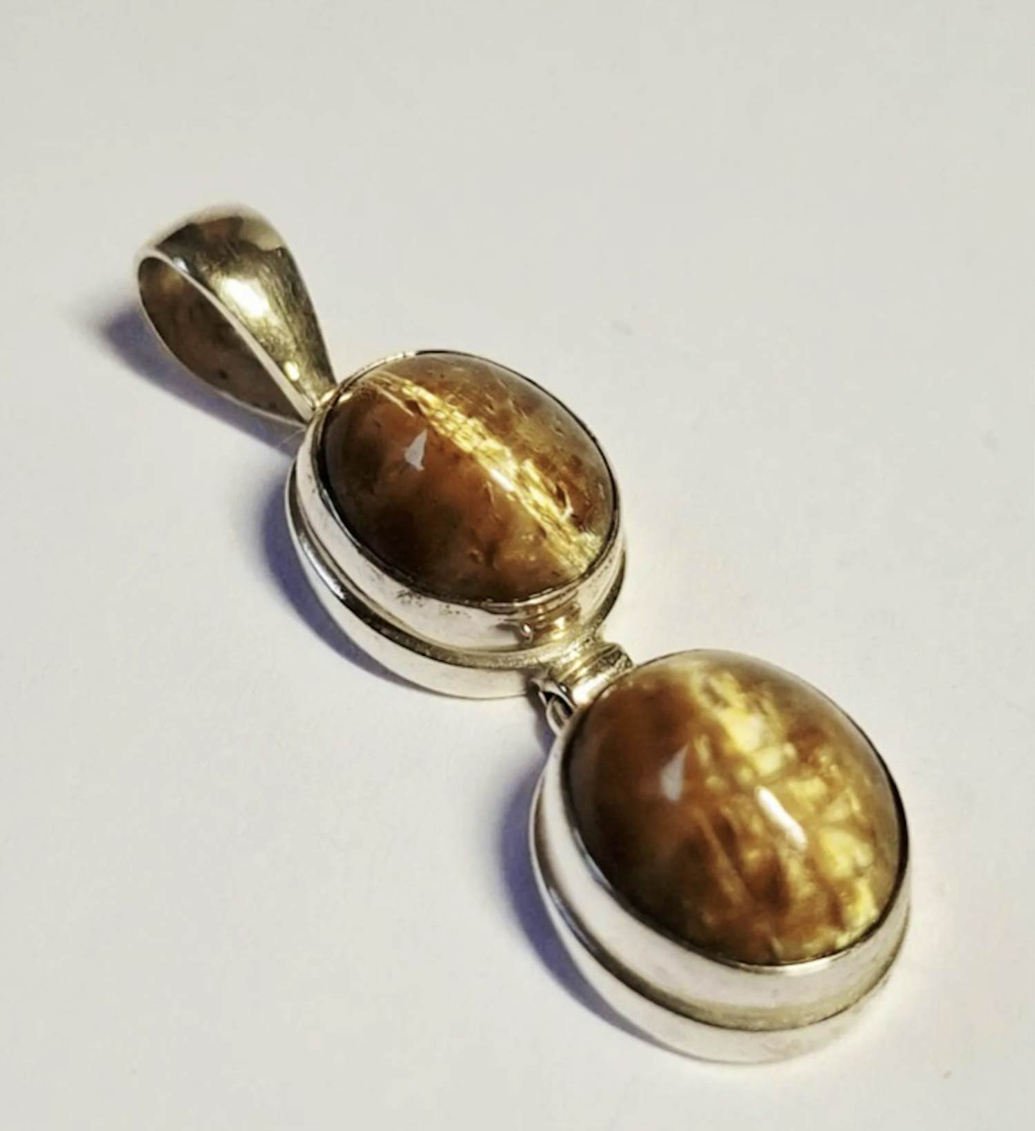 Nieuwe handgemaakte  langwerpige zilveren hanger met een mooie tijgerogen kopen? Bied vanaf 60!