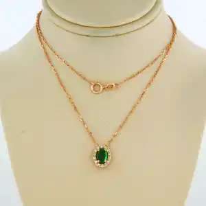 14k gouden collier met hanger met smaragd en briljant geslepen diamant verkocht voor € 175!