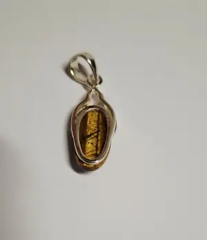 Nieuwe zilveren hanger met een mooie geslepen tijgeroog kopen? Bied vanaf 40!