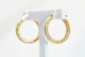 85 - 18 karaats geelgouden paar holle gedraaide oorringen kopen? Bied vanaf 280!