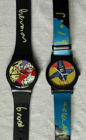 AcheterHerman Brood - 2x Horloge , “Erik Satie” en “Vliegtuig” – met doosjes? Enchérissez de 1!