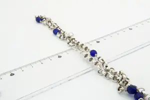 44 -  Lang (60cm) Surinaams 1e geh. Zilveren jasseron collier met  blauwe kralen kopen? Bied vanaf 25!