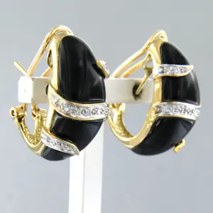 Acheter18k bicolour gouden oorclips met onyx en briljant geslepen diamant tot. 0.20ct? Enchérissez de 1400!