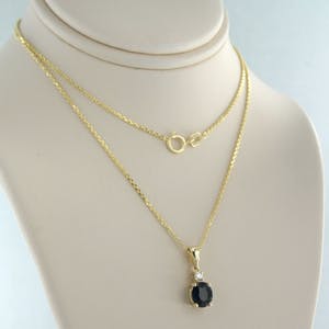 14k geel gouden collier met een hanger bezet met saffier en diamant kopen? Bied vanaf 240!