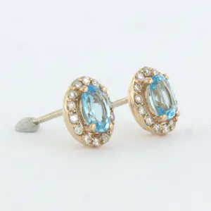 14k rosé gouden entourage oorknoppen met topaas en briljant geslepen diamant kopen? Bied vanaf 375!