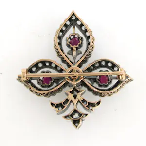 18k gouden broche bezet met robijn en diamant kopen? Bied vanaf 1200!