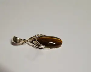 Nieuwe zilveren hanger met een mooie geslepen tijgeroog kopen? Bied vanaf 40!