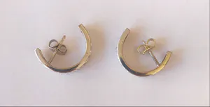 2 Creolen van witgoud met geslepen diamanten kopen? Bied vanaf 300!